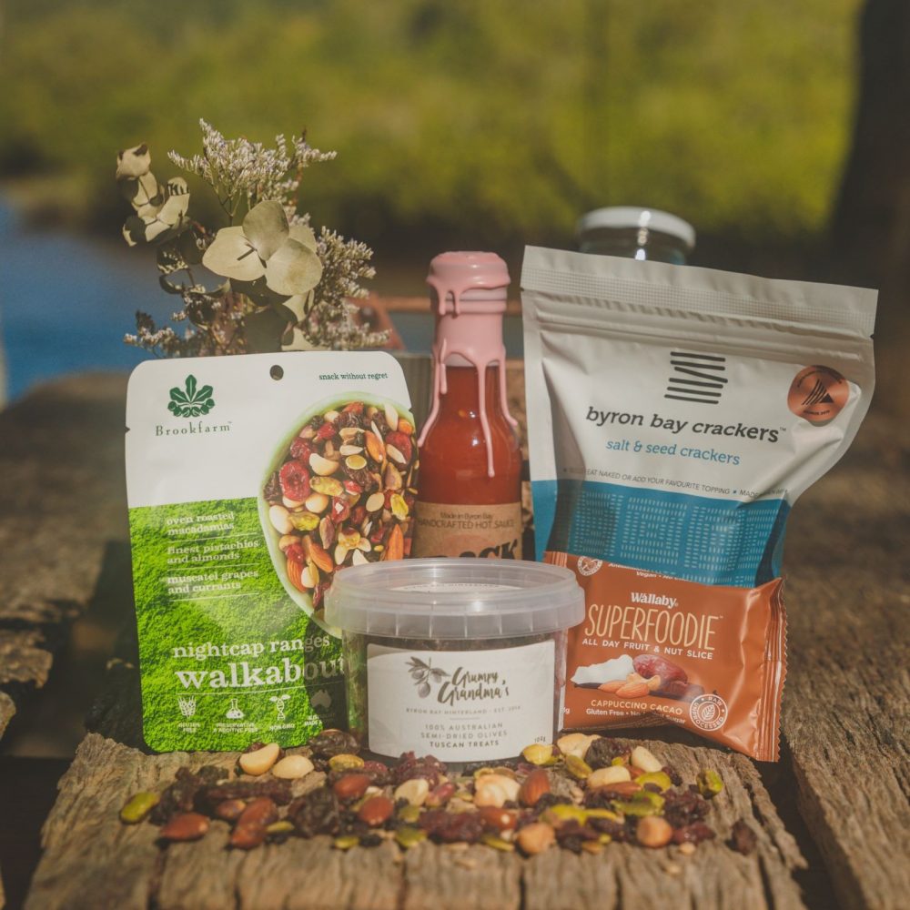 Byron Bay Cookies: White Chocolate & Macadamia Cookies, 75g Barefoot Farm: Dark Chocolate Pecans 130g Crack Fox: Fermented Habanero Hot Sauce 150ml Byron Bay Crackers: Salt & Seed 125g Zentvelds: Chocolate Espresso Beans 50g Duck Creek: Trio Chocolate Macadamias, 36g Grumpy Grandma's: Semi-dried Olives - Tuscan Treats 100g Brookfarm: Nightcap Ranges Trail Mix 75g Holy Nuts: Mini Pure Hazelnut Butter, 35g