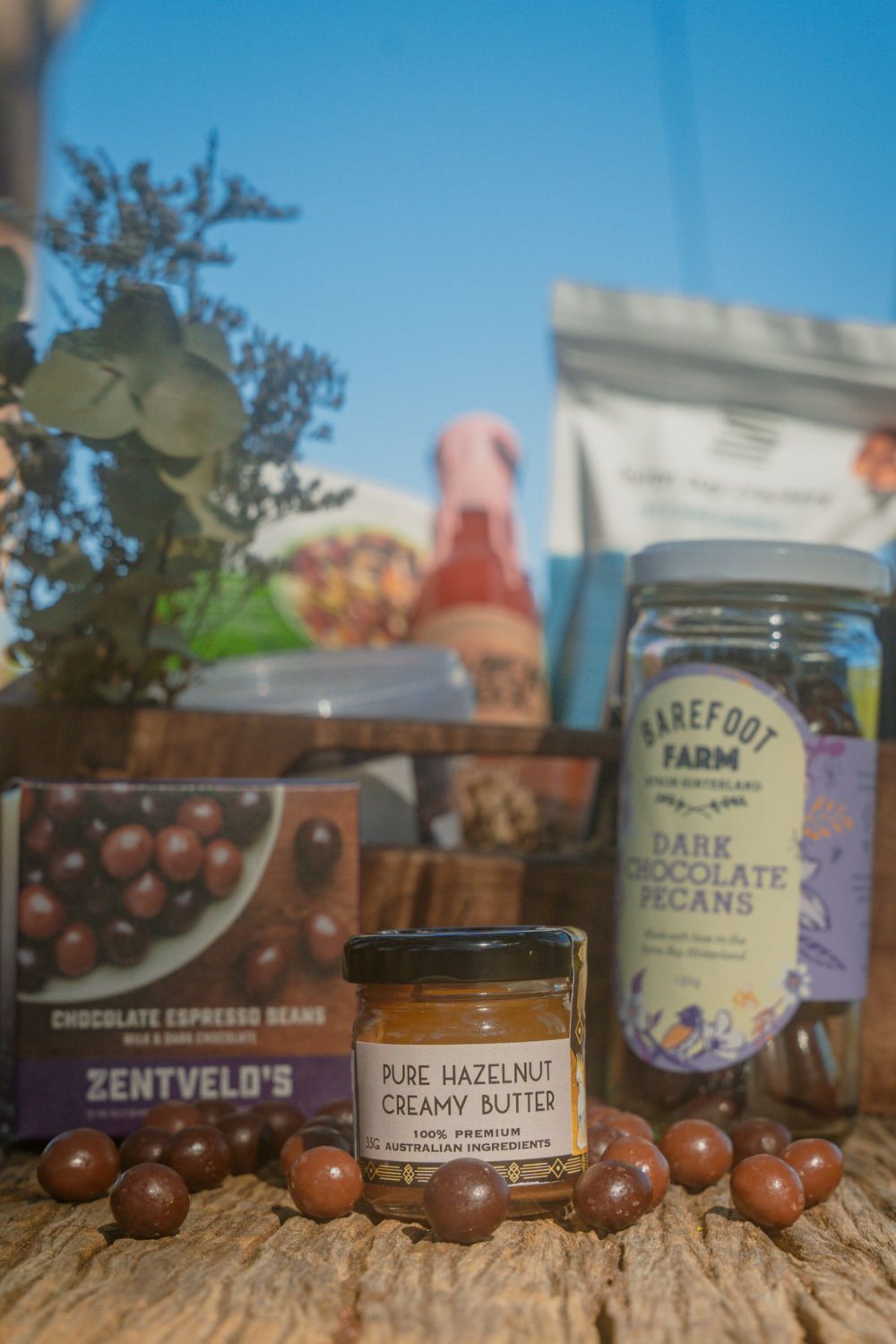 Byron Bay Cookies: White Chocolate & Macadamia Cookies, 75g Barefoot Farm: Dark Chocolate Pecans 130g Crack Fox: Fermented Habanero Hot Sauce 150ml Byron Bay Crackers: Salt & Seed 125g Zentvelds: Chocolate Espresso Beans 50g Duck Creek: Trio Chocolate Macadamias, 36g Grumpy Grandma's: Semi-dried Olives - Tuscan Treats 100g Brookfarm: Nightcap Ranges Trail Mix 75g Holy Nuts: Mini Pure Hazelnut Butter, 35g