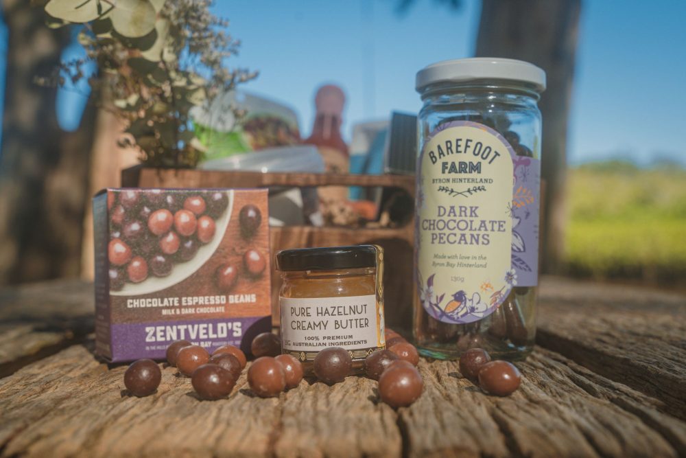 Byron Bay Cookies: White Chocolate & Macadamia Cookies, 75g Barefoot Farm: Dark Chocolate Pecans 130g Crack Fox: Fermented Habanero Hot Sauce 150ml Byron Bay Crackers: Salt & Seed 125g Zentvelds: Chocolate Espresso Beans 50g Duck Creek: Trio Chocolate Macadamias, 36g Grumpy Grandma's: Semi-dried Olives - Tuscan Treats 100g Brookfarm: Nightcap Ranges Trail Mix 75g Holy Nuts: Mini Pure Hazelnut Butter, 35g